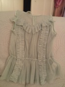 Koronkowa bluzka z baskinką w kolorze pistacjowym.36