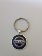 Brelok , breloczek , wypukłe szkło.. Nissan