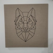 Lew geometryczny wyszyty na płótnie z lnu