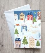 Kartka grająca bożonarodzeniowe z muzyką z kopertą Wesołych Świąt.