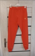 Spodnie dresowe ze ściągaczem w kolorze pomarańczy od MEGI.