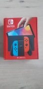 Konsola Nintendo Switch OLED wielokolorowy jak nowa