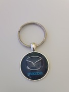 Brelok , breloczek , wypukłe szkło.. Mazda 