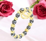 Pierścionek na gumce koraliki " kółka " pozłacane