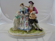 Scenka rodzajowa rodzina z klatką figurki