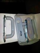 Klamki z szyldem podłużnym pełnym p.poż.