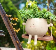 Wisząca doniczka na huśtawce na kwiatki