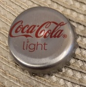 Kapsel Coca Cola butelkowane