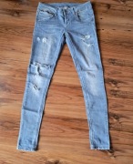 Spodnie damskie jeansy niebieskie 36/S z dziurami