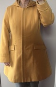 Musztardowy płaszcz na zamek z kapturem i kieszeniami Bonprix r. 46