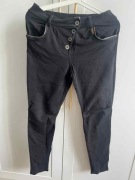 Spodnie dresowe damskie z suwakami i guzikami czarne UNISONO r. 36 S