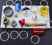 Breloki do kluczy w różnych kształtach części samochodowych, turbo, zacisk