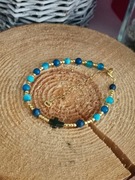 Bransoletka różaniec na lince krzyżyk howlit lapis lazuli regulacja kamieni