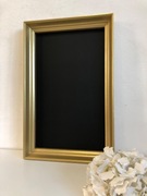 Tablica w złotej ramie na magnesy. Oryginalna tablica na menu