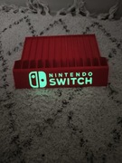 Stojak podstawka na gry Nintendo Switch napis fluorescencyjny 
