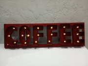 Blaszany szyld podświetlany żarówkami 