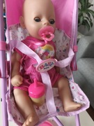 Lalka baby Born z wózkiem parasolką.