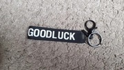 Breloczek na klucze z napisem na pasku "Good luck"