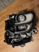 lewy reflektor do Mazdy CX-60/CX-80 na części lub remont