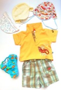 74 zestaw ubranek spodenki kąpielówki czapki 6 szt Kubuś Puchatek C&A
