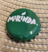 Kapsel Mirinda butelkowane