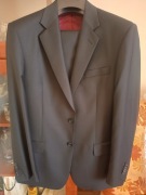 Nowy elegancki garnitur męski czarny 182/100/86 wełna 100%