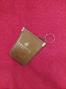 Futerał wykonany ze  skóry  z  lat  80-90  z napisem reklamy firmy 