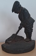 Zabytkowy żeliwny ogranicznik do drzwi golfista golf