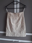 Beżowa elegancka spódnica z wzorkami z haftem na zamek do kolan XS litera A