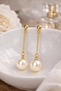 Długie kolczyki z perłą wiszące złote – eleganckie