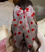 Czerwona spinka do włosów w kształcie kokardy