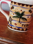 Piękny kubek zdobiony z napisem Peru . Prima Cafe