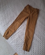 Musztardowe spodnie joggery chłopięce 158 Karmelowe Sinsay