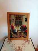 Obraz wyszywany w oprawie dębowej.