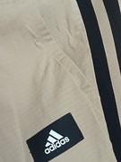 Adidas , beżowe joggersy