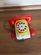 Zabawkowy telefon na kółkach