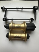 Piasty SHIMANO DEORE LX FH, HB-M570 G 135/9, 100/9 QR 36H ZŁOTE
