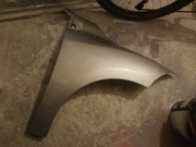 Błotnik prawy Megane 3. Kolor TEHNK.