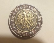 Monetą. 