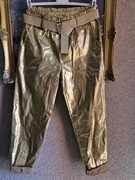 Spodnie damskie woskowane złote z kieszeniami z paskiem