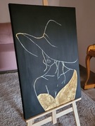 Kobieta w kapeluszu prezent na świeta