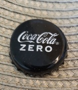 Kapsel Coca Cola butelkowane