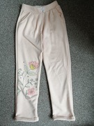 Cienkie spodnie dresowe Lupilu 110 116 kwiaty 