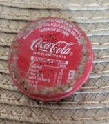 Kapsel Coca Cola butelkowane