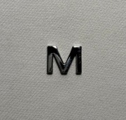 SMEG logo | litera „M” | emblemat AGD czajnik toster chrom