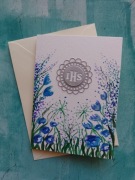 Kartka komunijna ręcznie wykonana z ręcznie malowanymi kwiatami 