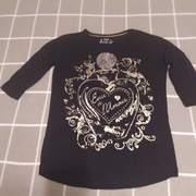 bluzka czarna ze złotym motywem rękaw 3/4 rozm.140