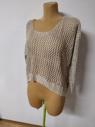 Beżowa bluzka z błyszczącą nitka