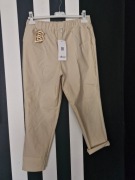 Spodnie damskie Minouu beżowe, cygaretki. brelok BB, kieszenie