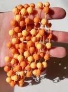 Naszyjnik kaskada pomarańczowy szklany neonowy sznurek supełki wielorzędowy